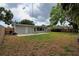 Spacious backyard with a well-maintained lawn offering plenty of room for outdoor activities and relaxation at 4105 W Oakellar Ave, Tampa, FL 33611