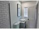 Modern bathroom featuring subway tile shower and vessel sink at 4105 W Oakellar Ave, Tampa, FL 33611