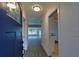 View of the front foyer with a view of the living room and access to the kitchen at 4105 W Oakellar Ave, Tampa, FL 33611