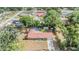 Charming property with a private screened-in pool, storage shed, and mature trees offering a serene, secluded oasis at 414 Cactus Cir, Seffner, FL 33584