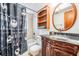 Bathroom with custom cabinets and unique shower curtain at 414 Cactus Cir, Seffner, FL 33584