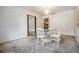 Dining room features a chandelier and glass table at 414 Cactus Cir, Seffner, FL 33584