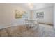 Dining room features a mural on the wall and glass table at 414 Cactus Cir, Seffner, FL 33584
