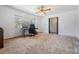 Inviting room featuring carpet and natural light, offering versatility as a bedroom or workspace at 414 Cactus Cir, Seffner, FL 33584
