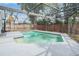 Enjoy this screened-in pool with a refreshing water view surrounded by an expansive deck and fenced yard for privacy at 414 Cactus Cir, Seffner, FL 33584