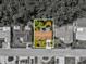 Aerial view of property highlighting the property lines surrounded by mature trees at 4408 Rudder Way, New Port Richey, FL 34652