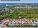 Aerial view of homes on the water with private docks and lush green surroundings with easy access to Route 19 at 4408 Rudder Way, New Port Richey, FL 34652
