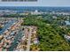 Scenic aerial view showcasing the neighborhood with waterfront access and lush greenery at 4408 Rudder Way, New Port Richey, FL 34652