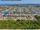 Expansive aerial view of waterfront homes, docks, and canals in a coastal community, showcasing nearby open water at 4408 Rudder Way, New Port Richey, FL 34652