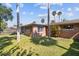 Spacious backyard with lush green grass, mature trees, and privacy fence at 4408 Rudder Way, New Port Richey, FL 34652