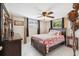 Well-lit bedroom with tile floors, neutral walls, ample storage, and natural light at 4408 Rudder Way, New Port Richey, FL 34652