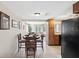 Cozy dining room with seating for four, tile flooring, and abundant natural light at 4408 Rudder Way, New Port Richey, FL 34652