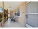 Cozy front porch area with seating, providing a welcoming entrance to the home at 4408 Rudder Way, New Port Richey, FL 34652