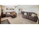 Comfortable living room with tile flooring, ceiling fan, and a well-lit space at 4408 Rudder Way, New Port Richey, FL 34652