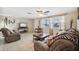 Comfortable living room with tile floors, fan, and lots of natural light coming in from the windows at 4408 Rudder Way, New Port Richey, FL 34652