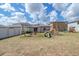 Fenced backyard with playset and lawn at 4507 Eternal Prince Dr, Sun City Center, FL 33573