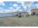 Spacious backyard features a playset with a slide and swings at 4507 Eternal Prince Dr, Sun City Center, FL 33573