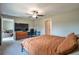 Comfortable bedroom offers natural light and ceiling fan at 4507 Eternal Prince Dr, Sun City Center, FL 33573