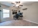 Bedroom with ceiling fan, floating shelves and desk at 4507 Eternal Prince Dr, Sun City Center, FL 33573