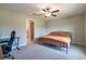 Bedroom with neutral paint, ceiling fan, and ensuite bathroom at 4507 Eternal Prince Dr, Sun City Center, FL 33573