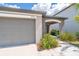 Close-up on garage of home with manicured landscaping and welcoming front entrance at 4507 Eternal Prince Dr, Sun City Center, FL 33573