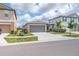 Traditional one-story home with a two-car garage, tidy landscaping, and a well-maintained lawn at 4507 Eternal Prince Dr, Sun City Center, FL 33573