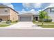 Exterior shot showcasing a two-car garage, driveway, and attractive landscaping adding curb appeal at 4507 Eternal Prince Dr, Sun City Center, FL 33573