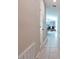 Hallway features tile floors and neutral colored walls at 4507 Eternal Prince Dr, Sun City Center, FL 33573
