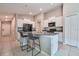 Modern kitchen featuring an island with seating, stainless appliances, and white cabinets at 4507 Eternal Prince Dr, Sun City Center, FL 33573
