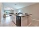 Kitchen island with dishwasher provides extra counter space in this open-concept living area at 4507 Eternal Prince Dr, Sun City Center, FL 33573