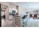 Bright kitchen with island seating, stainless appliances and open concept floor plan at 4507 Eternal Prince Dr, Sun City Center, FL 33573