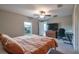 Neutral bedroom features ceiling fan, closet and window allowing for natural light to enter at 4507 Eternal Prince Dr, Sun City Center, FL 33573