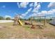 Backyard playground set with swings, slide and seesaw, perfect for to play in the backyard at 4507 Eternal Prince Dr, Sun City Center, FL 33573