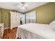 Bedroom with armoire and hardwood floors at 4509 S Cortez Ave, Tampa, FL 33611