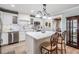 Modern kitchen with white cabinets, an island, and stainless steel appliances at 4509 S Cortez Ave, Tampa, FL 33611