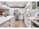 Beautiful kitchen featuring white cabinets, stainless steel appliances, and a large island at 4509 S Cortez Ave, Tampa, FL 33611
