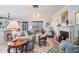 Bright living room with a fireplace, comfortable seating, and seamless flow to the sunroom and kitchen at 4509 S Cortez Ave, Tampa, FL 33611