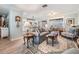 Open-concept living room flowing into kitchen, with hardwood floors and neutral decor at 4509 S Cortez Ave, Tampa, FL 33611