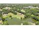 The property features multiple ponds and a barn, all surrounded by dense greenery at 4706 Scott Rd, Lutz, FL 33558