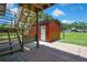 Outdoor view of the entrance to barn storage room features steps and brick flooring at 4706 Scott Rd, Lutz, FL 33558