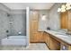 A well-lit bathroom with a separate shower and tub, a spacious vanity and modern fixtures at 4706 Scott Rd, Lutz, FL 33558