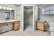Bright bathroom with a walk-in shower, granite countertops and wooden cabinets at 4706 Scott Rd, Lutz, FL 33558