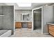 A spacious bathroom is equipped with a vanity, shower, and a soaking tub at 4706 Scott Rd, Lutz, FL 33558