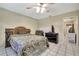 Bedroom with dresser, and ceiling fan, and open doorway at 4706 Scott Rd, Lutz, FL 33558