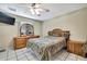 Bedroom with dresser, tv and ceiling fan at 4706 Scott Rd, Lutz, FL 33558