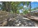 Long driveway lined with trees, landscaping, and fencing providing a private and picturesque entrance to the property at 4706 Scott Rd, Lutz, FL 33558