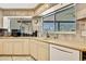 This bright kitchen is equipped with light wood cabinets, tile backsplash and stainless steel appliances at 4706 Scott Rd, Lutz, FL 33558