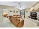 Comfortable living room with tile floors, a ceiling fan, and a view into the bedroom at 4706 Scott Rd, Lutz, FL 33558