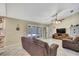 Living room with tile flooring and French doors to the backyard at 4706 Scott Rd, Lutz, FL 33558