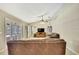 Open living room features tile flooring, and a ceiling fan at 4706 Scott Rd, Lutz, FL 33558